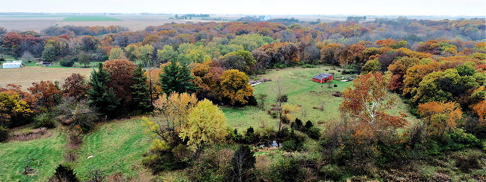 1250 North 1259th Road Grand Ridge, IL 61325 - Photo 9 of 9 an aerial view of a houses with a lush green hillside