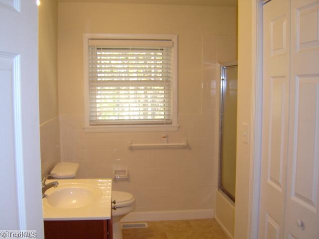 1002 Gideon Grove Road Stokesdale, NC 27357 - Photo 12 of 12 Other. 2nd bath with new tile floors and laundry room with cabinets