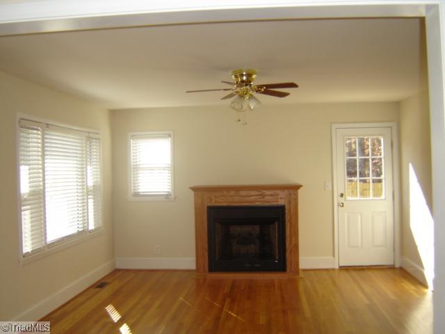 1002 Gideon Grove Road Stokesdale, NC 27357 - Photo 4 of 12 Living Room. Light filled living room with a gas fireplace