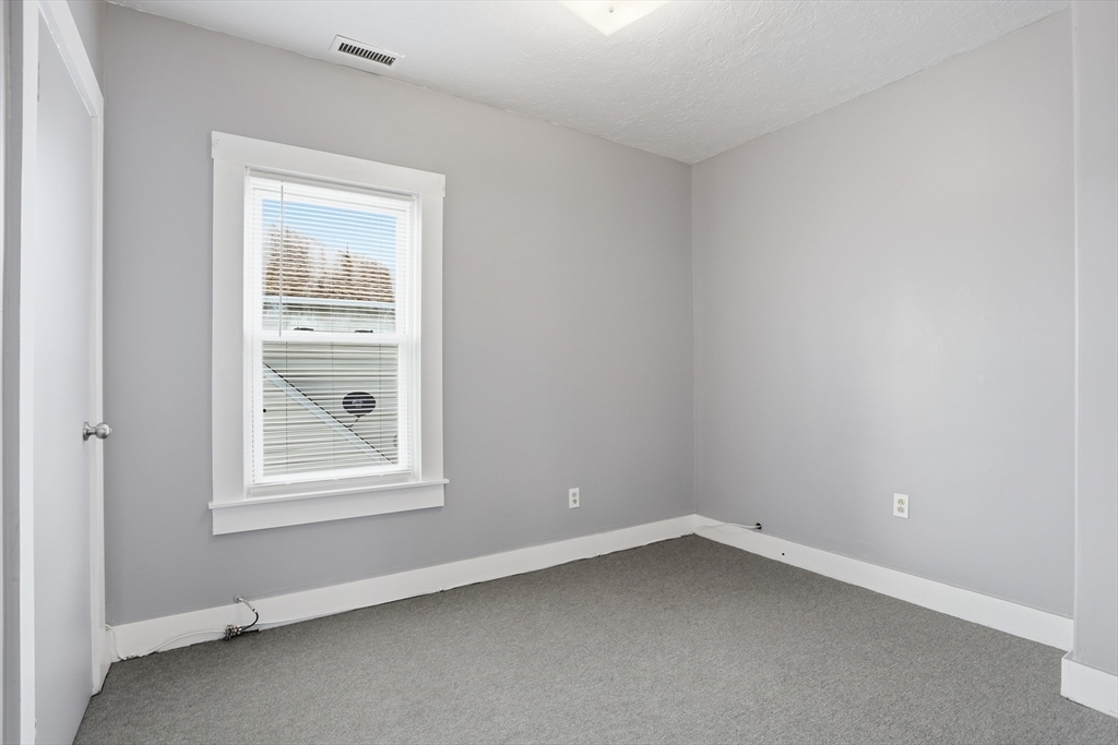 12 Whitcomb Street Webster, MA 01570 - Photo 21 of 40 an empty room with a window