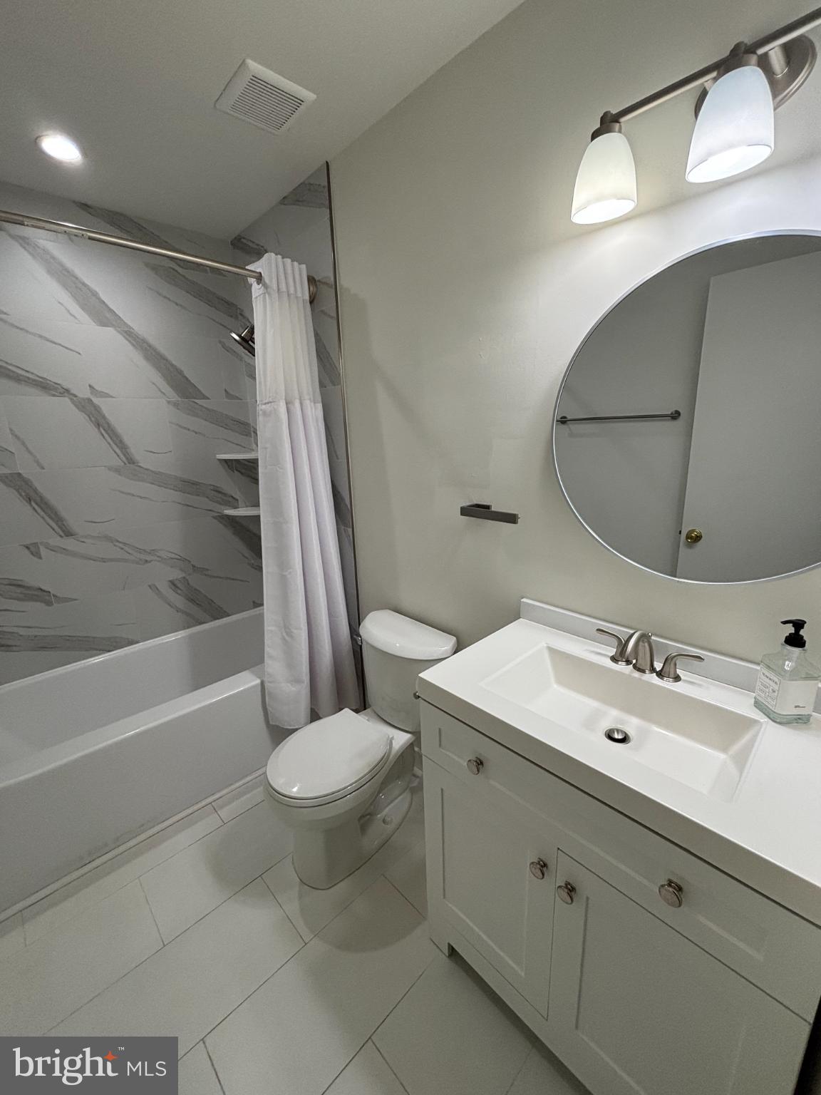 612 North Shady Retreat Road, Unit 55 Doylestown, PA 18901 - Photo 14 of 23 a bathroom with a sink a toilet and shower