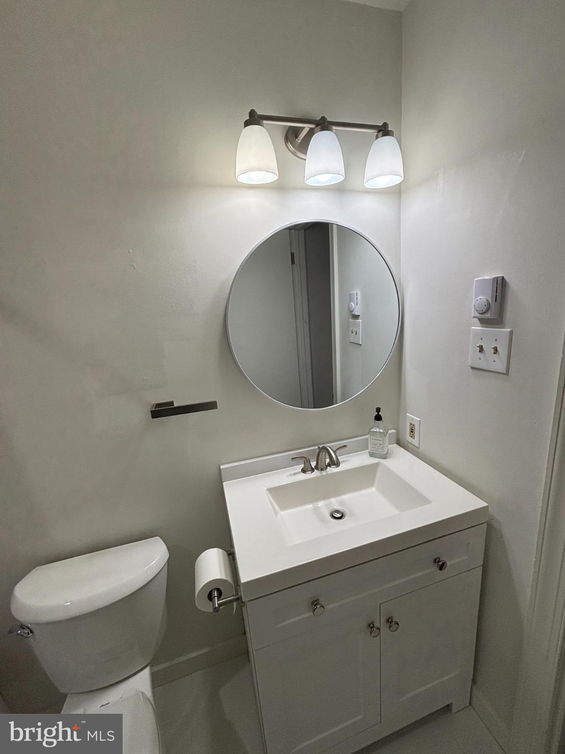 612 North Shady Retreat Road, Unit 55 Doylestown, PA 18901 - Photo 16 of 23 a bathroom with a toilet sink and mirror