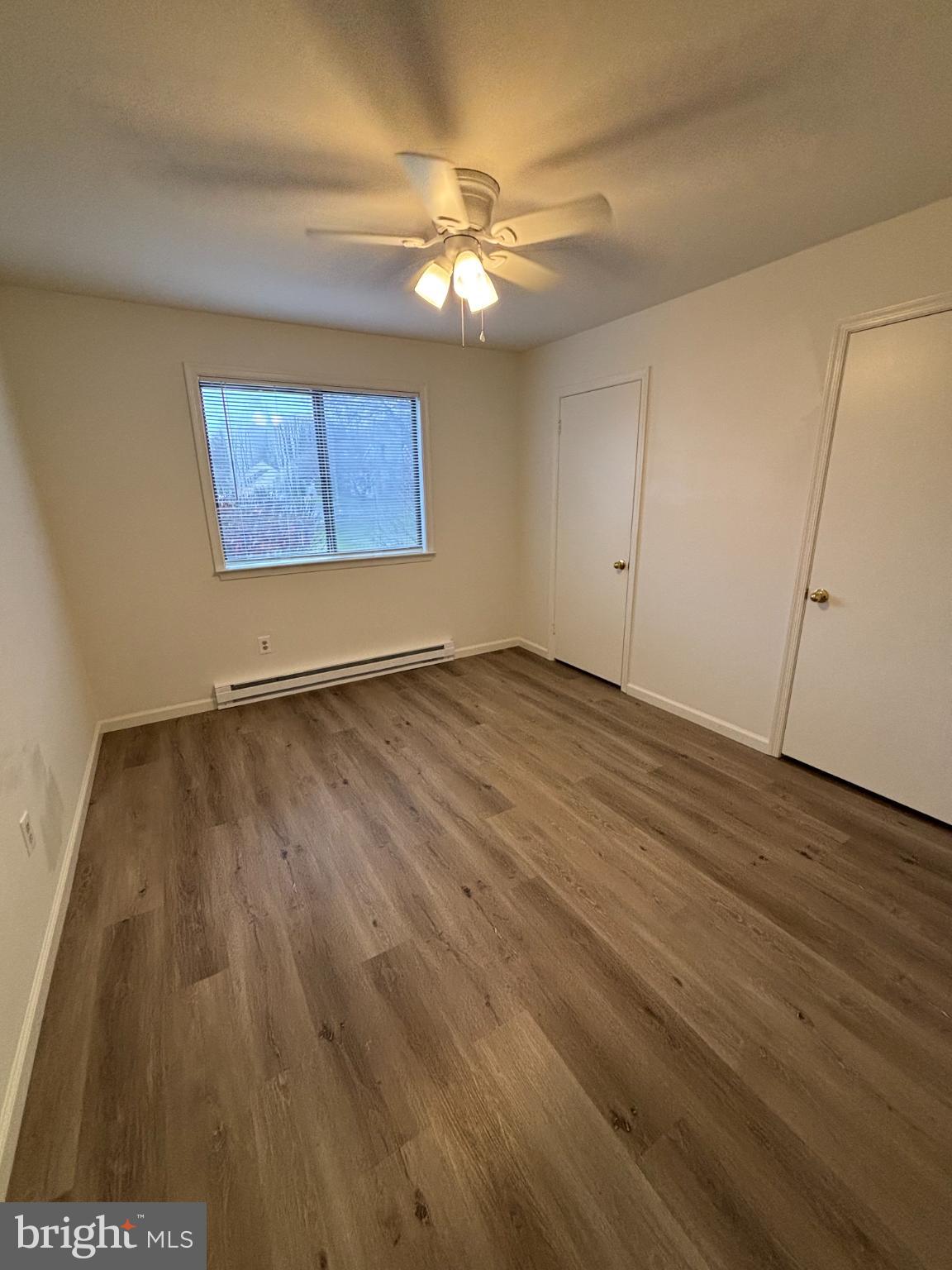 612 North Shady Retreat Road, Unit 55 Doylestown, PA 18901 - Photo 17 of 23 a view of an empty room with wooden floor