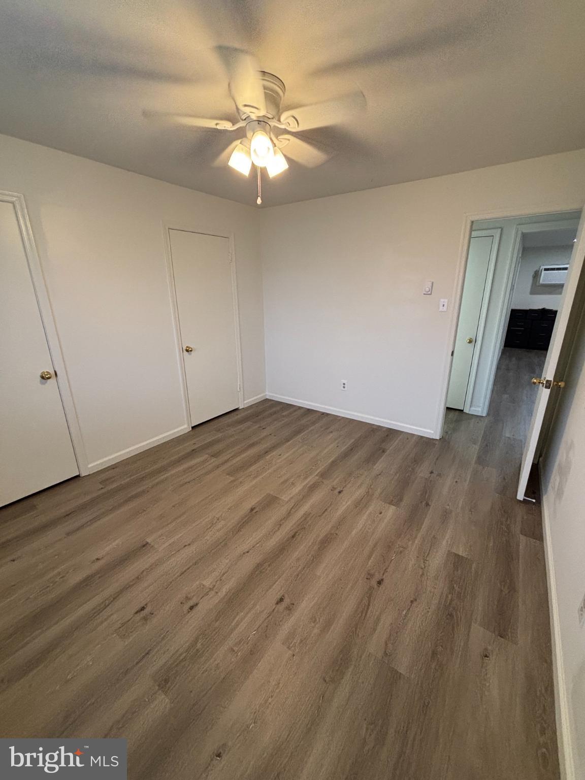 612 North Shady Retreat Road, Unit 55 Doylestown, PA 18901 - Photo 19 of 23 a view of an empty room with wooden floor