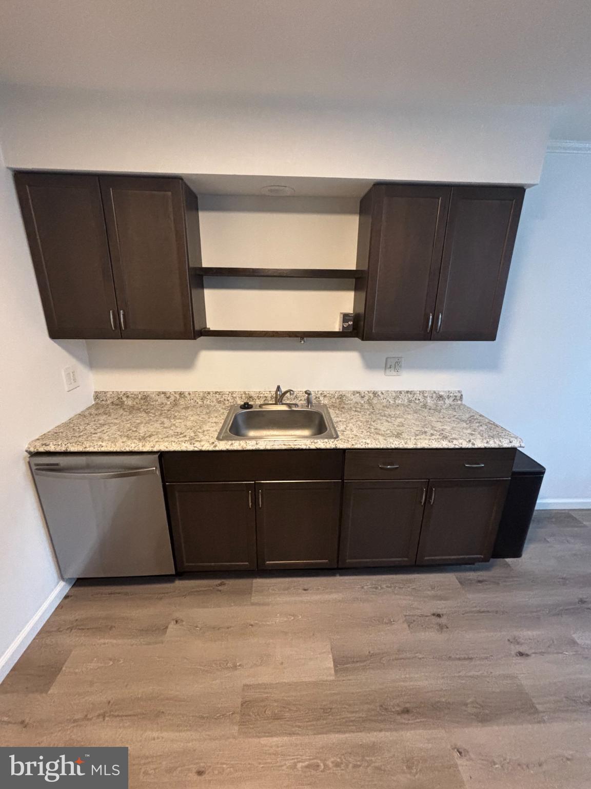 612 North Shady Retreat Road, Unit 55 Doylestown, PA 18901 - Photo 5 of 23 a room with kitchen island granite countertop wooden cabinets and vanity