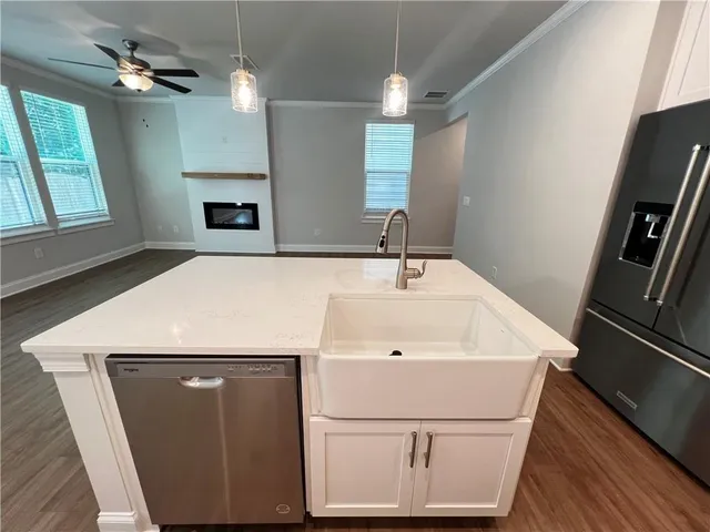 a bathroom with a sink and a large mirror