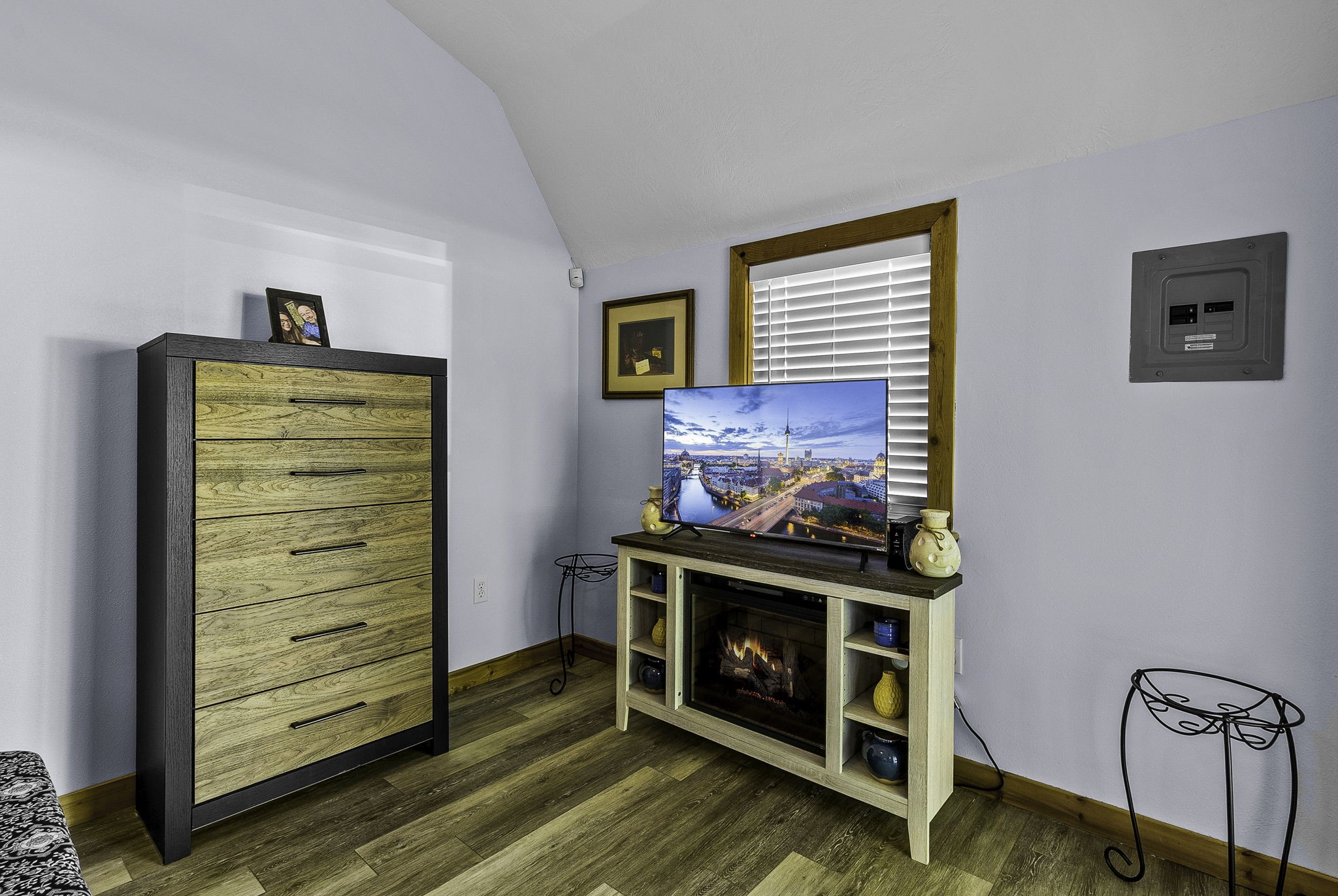 188 Huckleberry Road Onalaska, TX 77360 - Photo 30 of 49 a room with a fireplace and a wooden floor