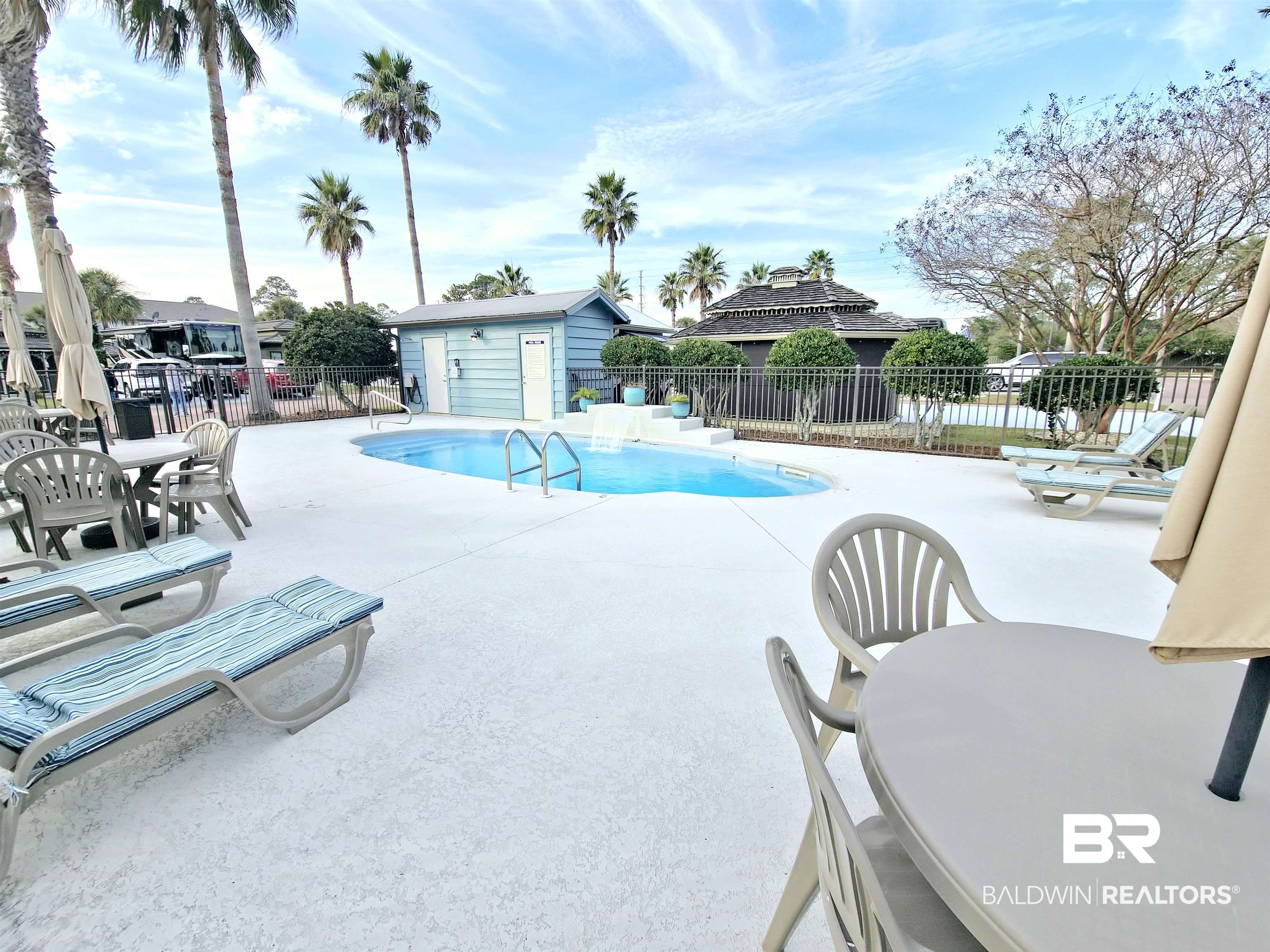4650 Griffith Marina Road, Unit 12 Orange Beach, AL 36561 - Photo 30 of 34 Community pool featuring a patio area, outdoor dining area, and an restrooms
