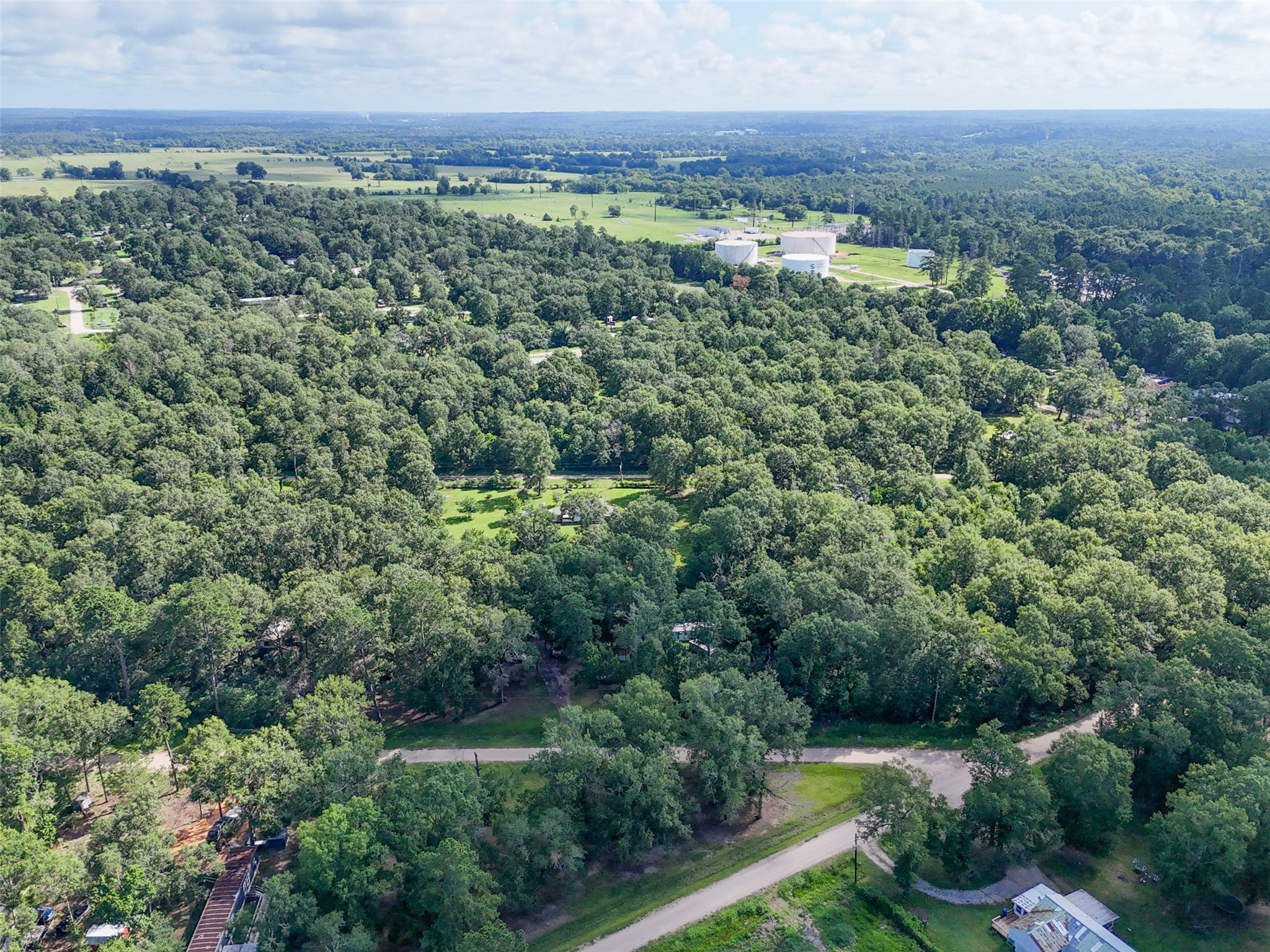 116 San Juan Livingston, TX 77351 - Photo 16 of 24 an aerial view of residential house with outdoor space and trees all around