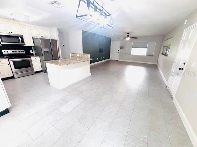 a view of a kitchen with a sink