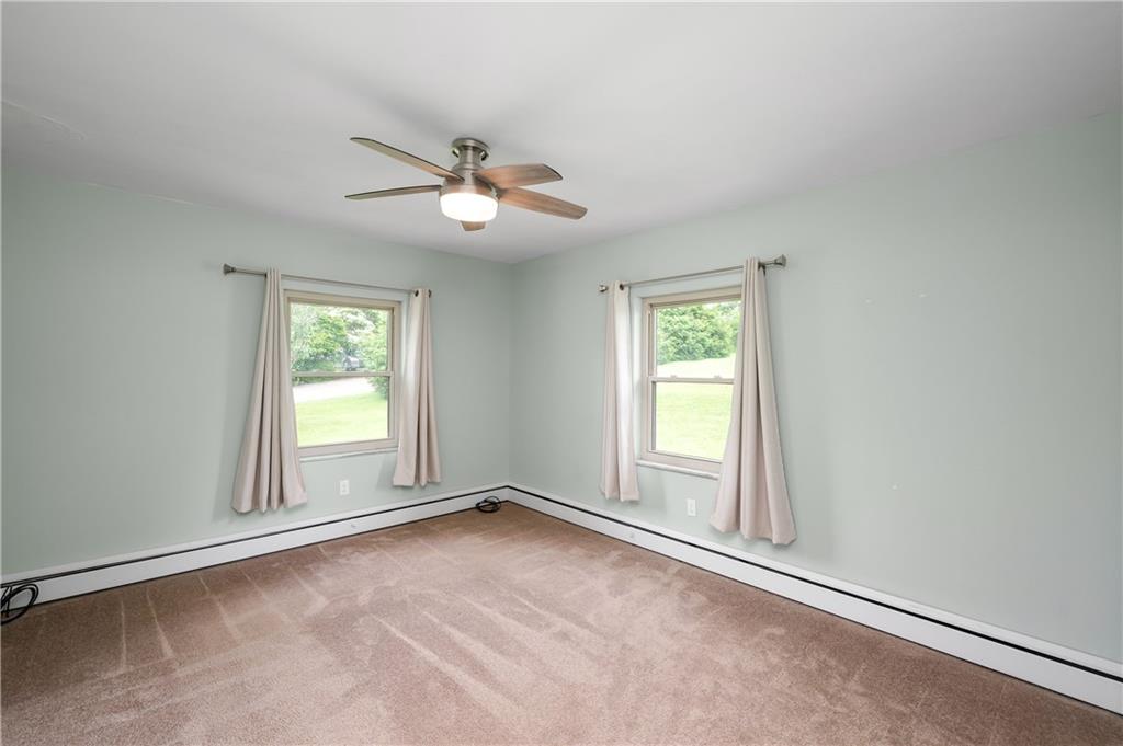 120 West Sunbury Road Butler, PA 16001 - Photo 20 of 46 an empty room with windows and ceiling fan