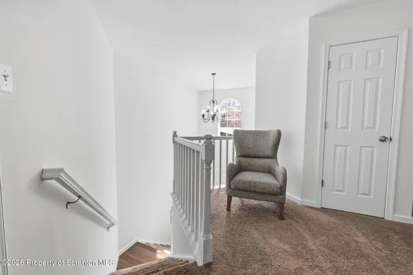 a spacious bedroom with a bed and a couch