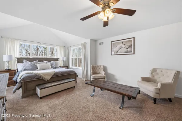 a bedroom with a bed and a closet