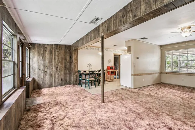 a view of room with window and ceiling fan