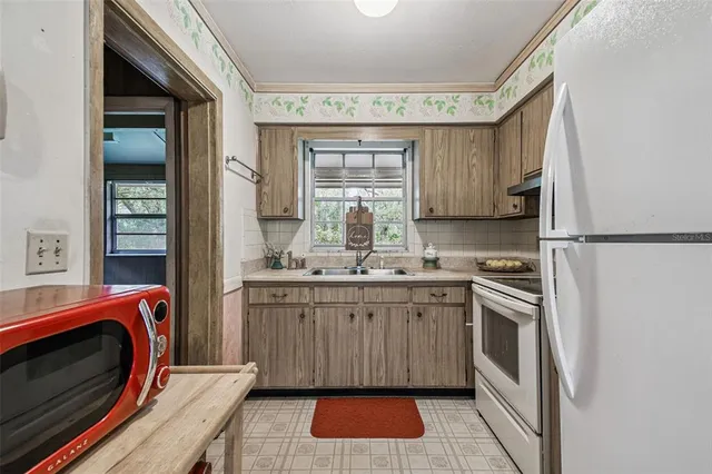 a view of outdoor space with deck and tree