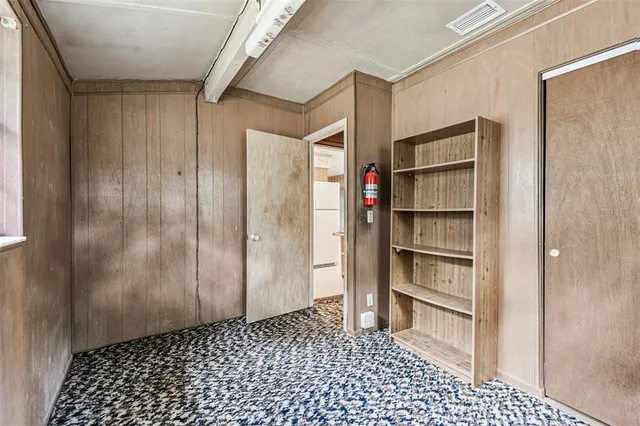 an aerial view of a houses with a yard