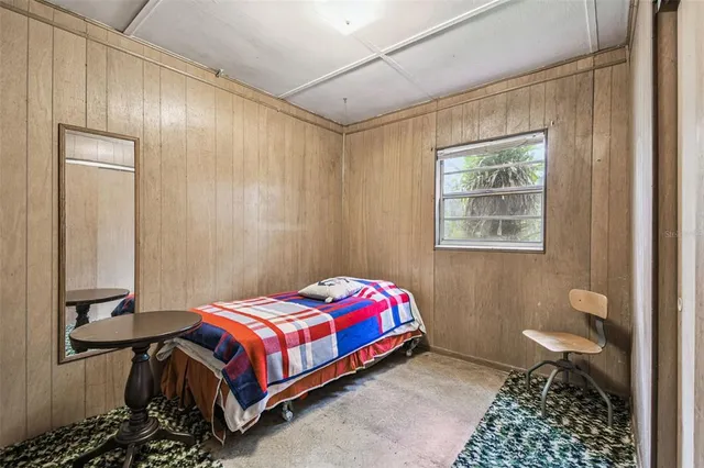 a view of a forest with a building in the background