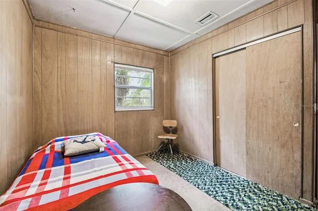 a picture of a wall with a painting on the wall and a picture of a bathroom