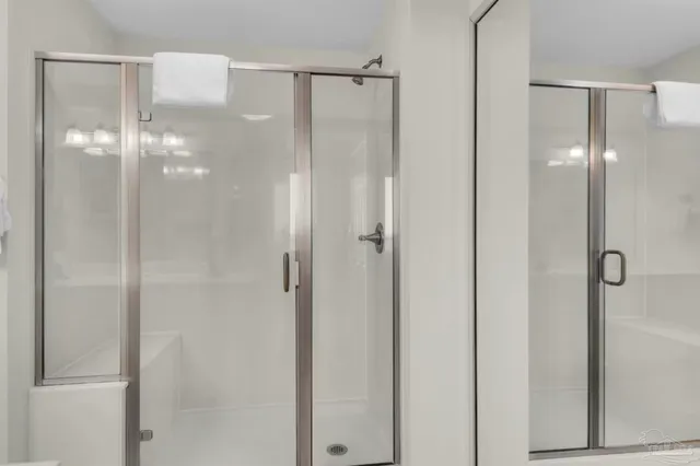 a bathroom with a glass shower door