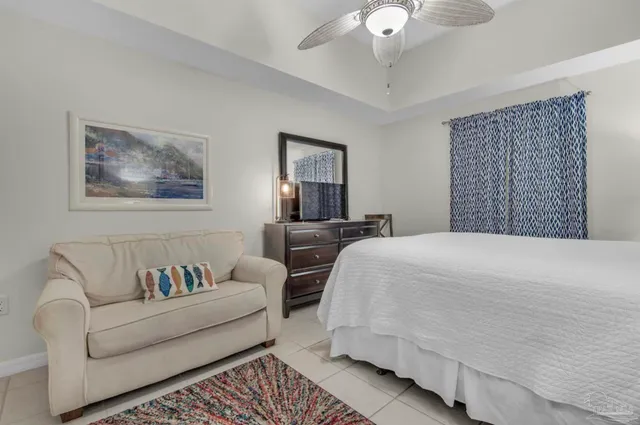 a bedroom with a bed and a couch