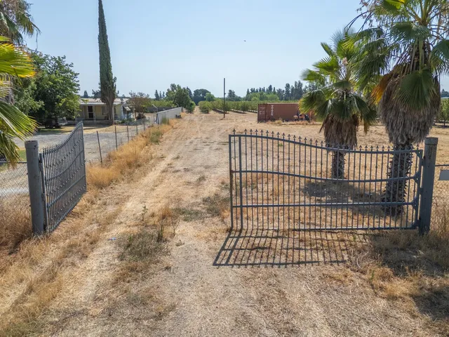 a view of a wrought iron fences in front of house