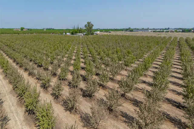 a view of a lake with houses in the back