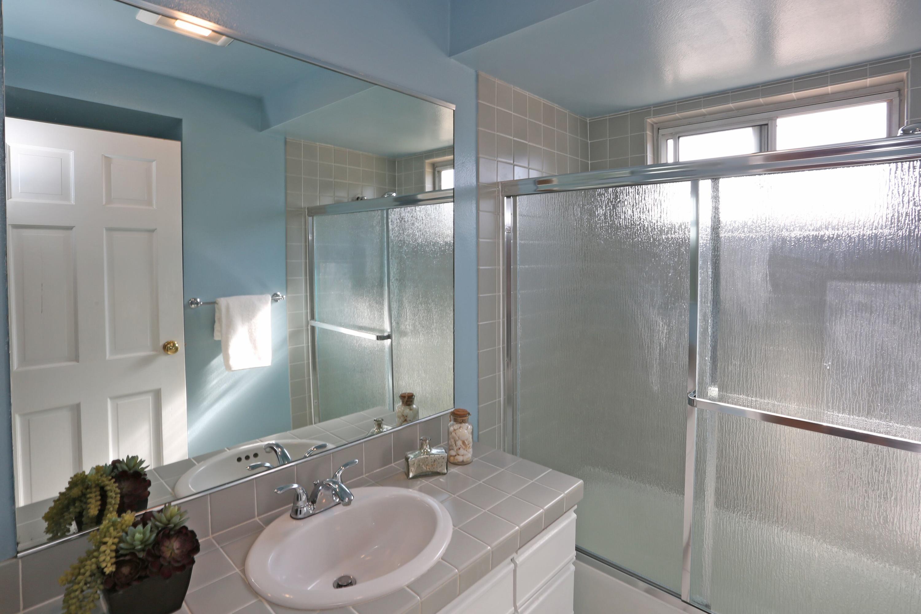 5668 Encina Road Goleta, CA 93117 - Photo 12 of 16 a bathroom with a sink and a mirror