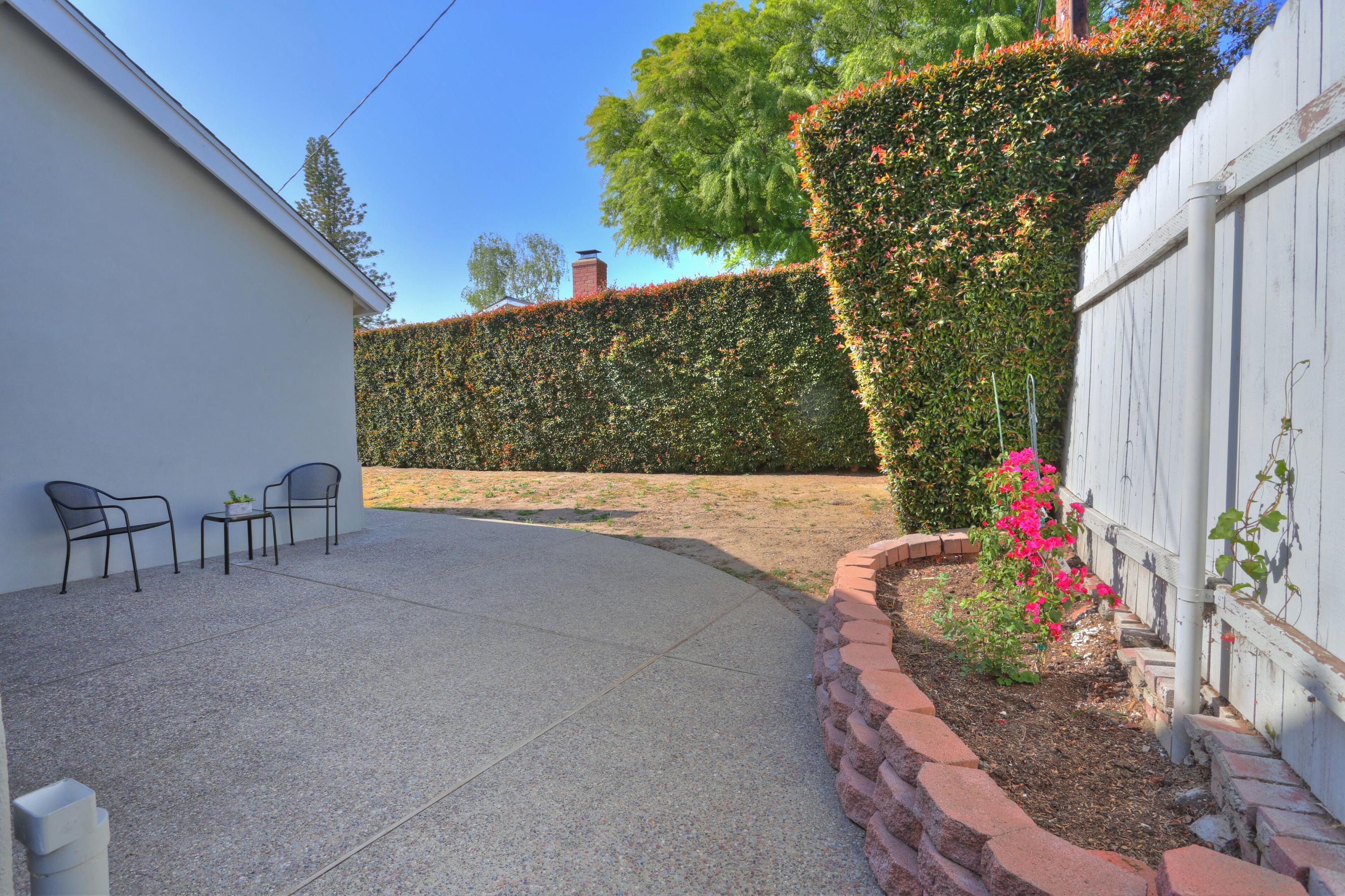 5668 Encina Road Goleta, CA 93117 - Photo 14 of 16 a view of backyard with plants and outdoor seating