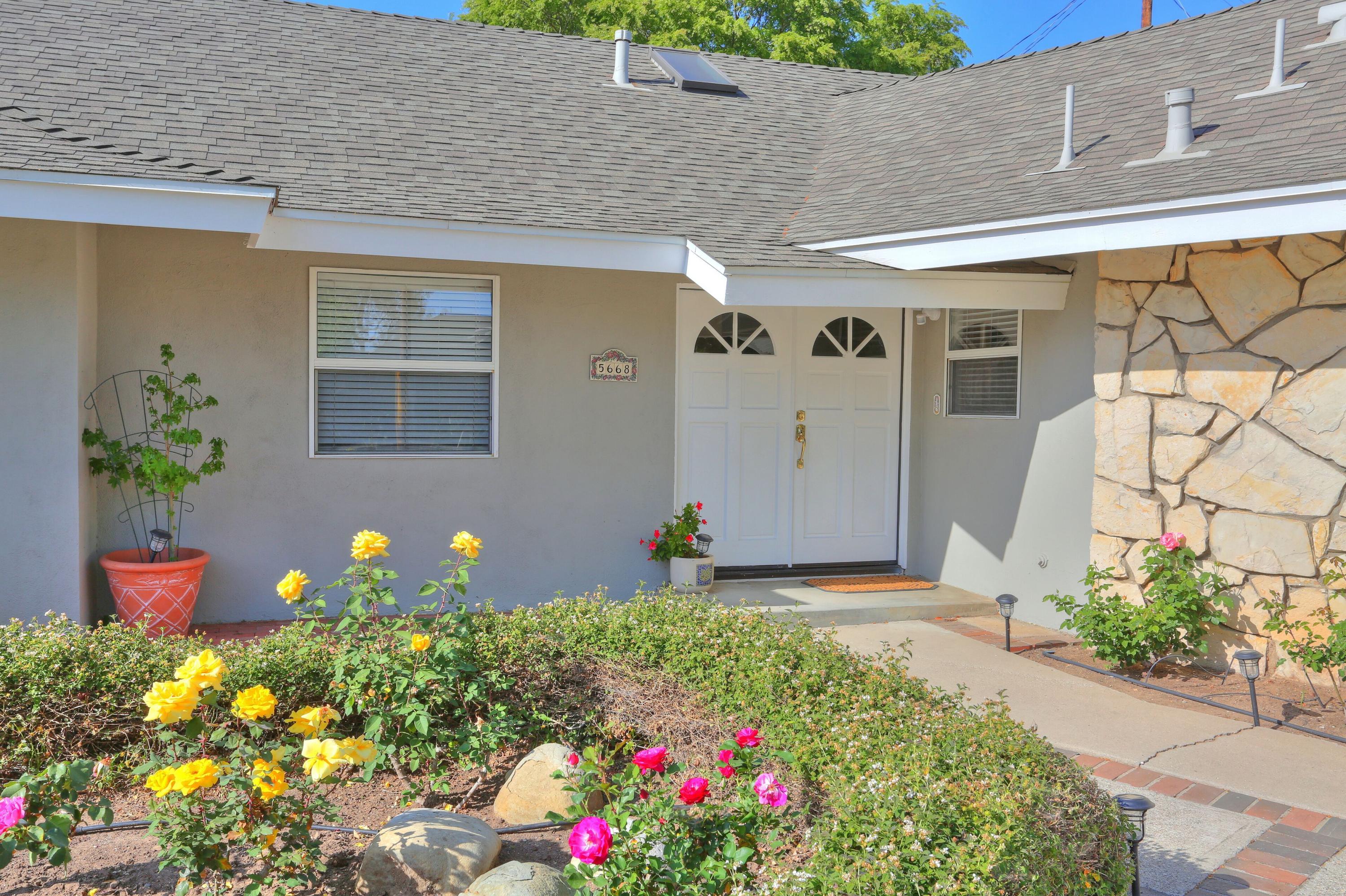 5668 Encina Road Goleta, CA 93117 - Photo 16 of 16 a front view of a house with flowers
