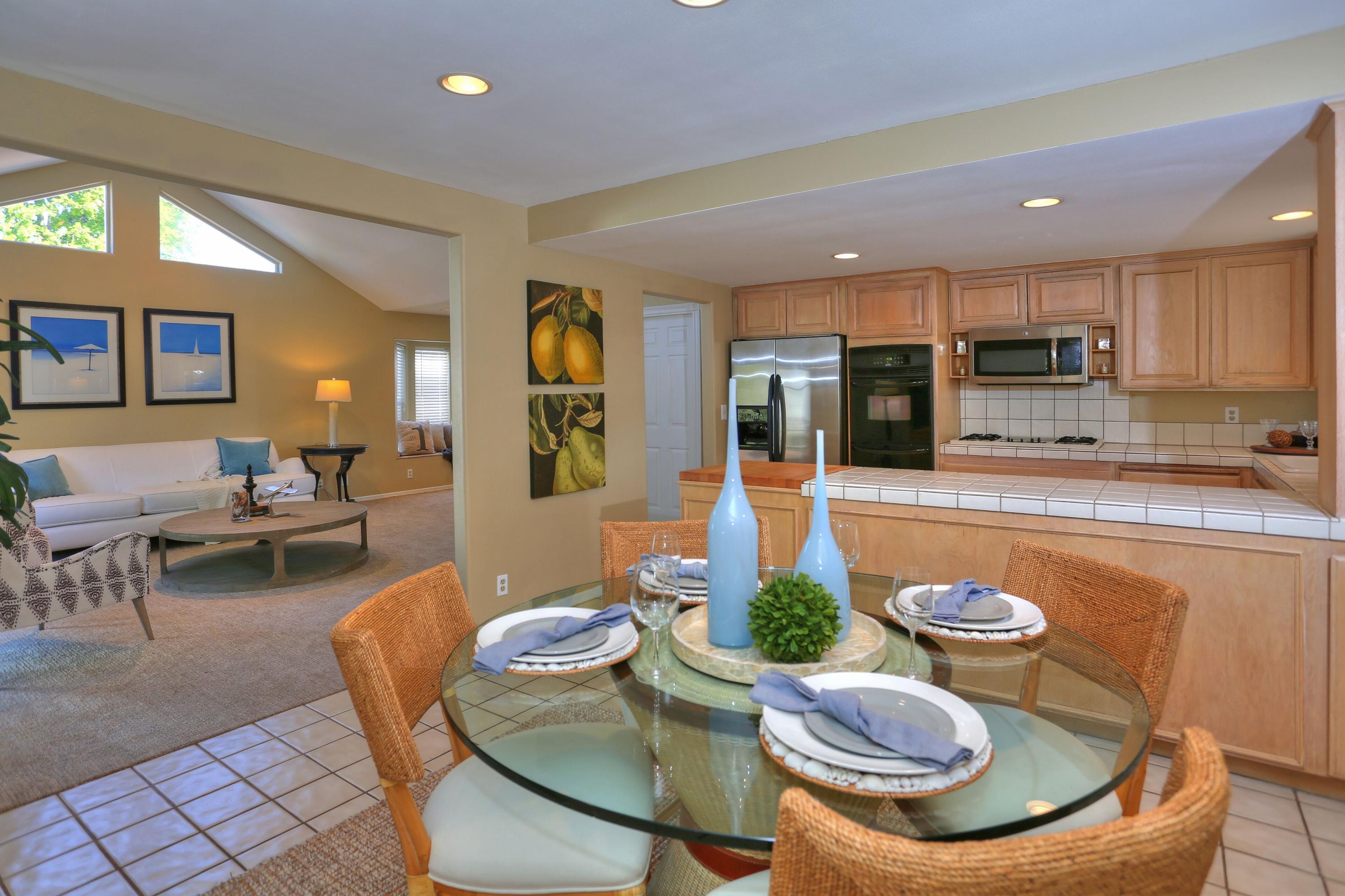 5668 Encina Road Goleta, CA 93117 - Photo 4 of 16 a kitchen with a table chairs stove and kitchen view