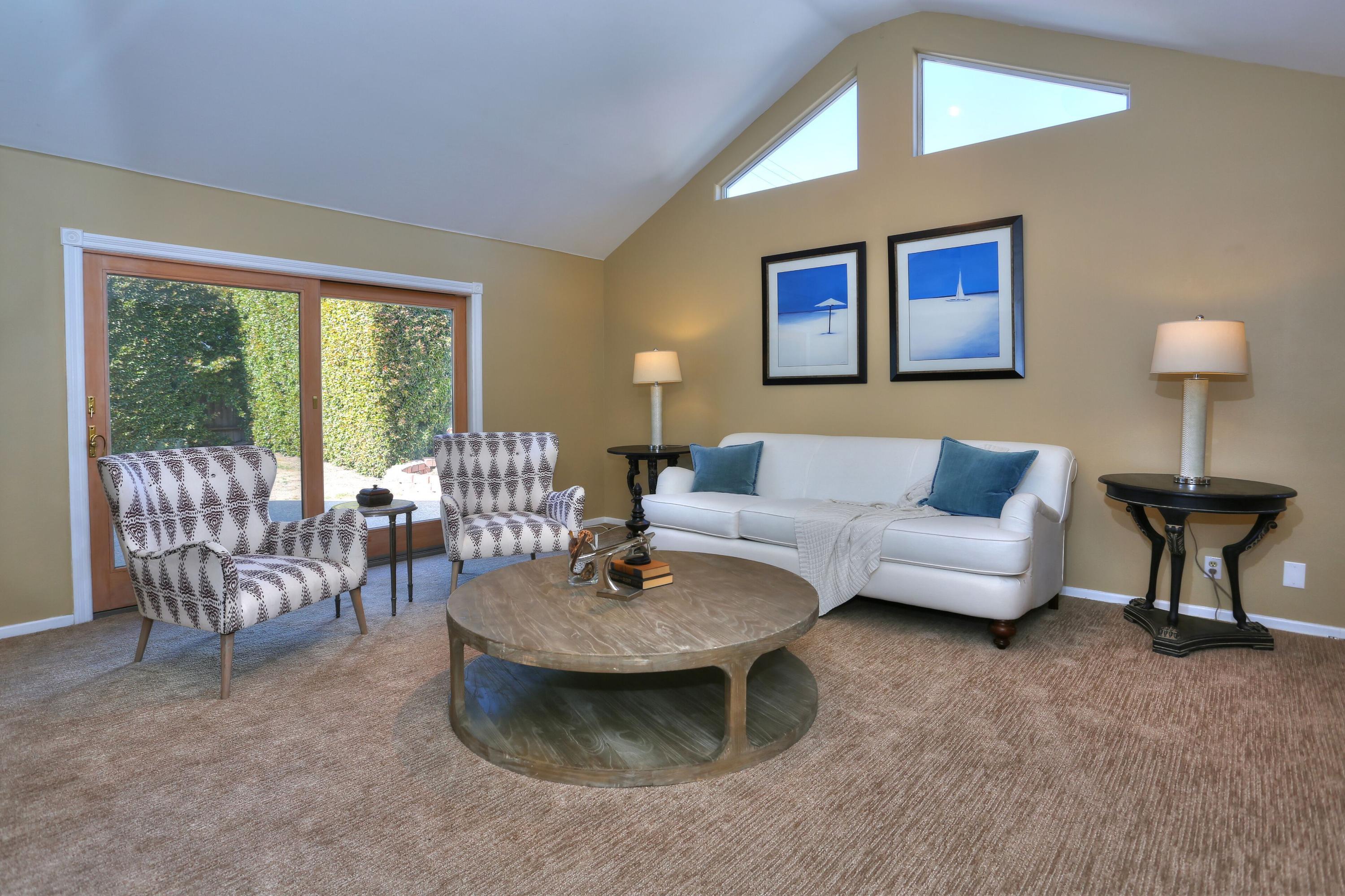 5668 Encina Road Goleta, CA 93117 - Photo 7 of 16 a living room with furniture and a large window