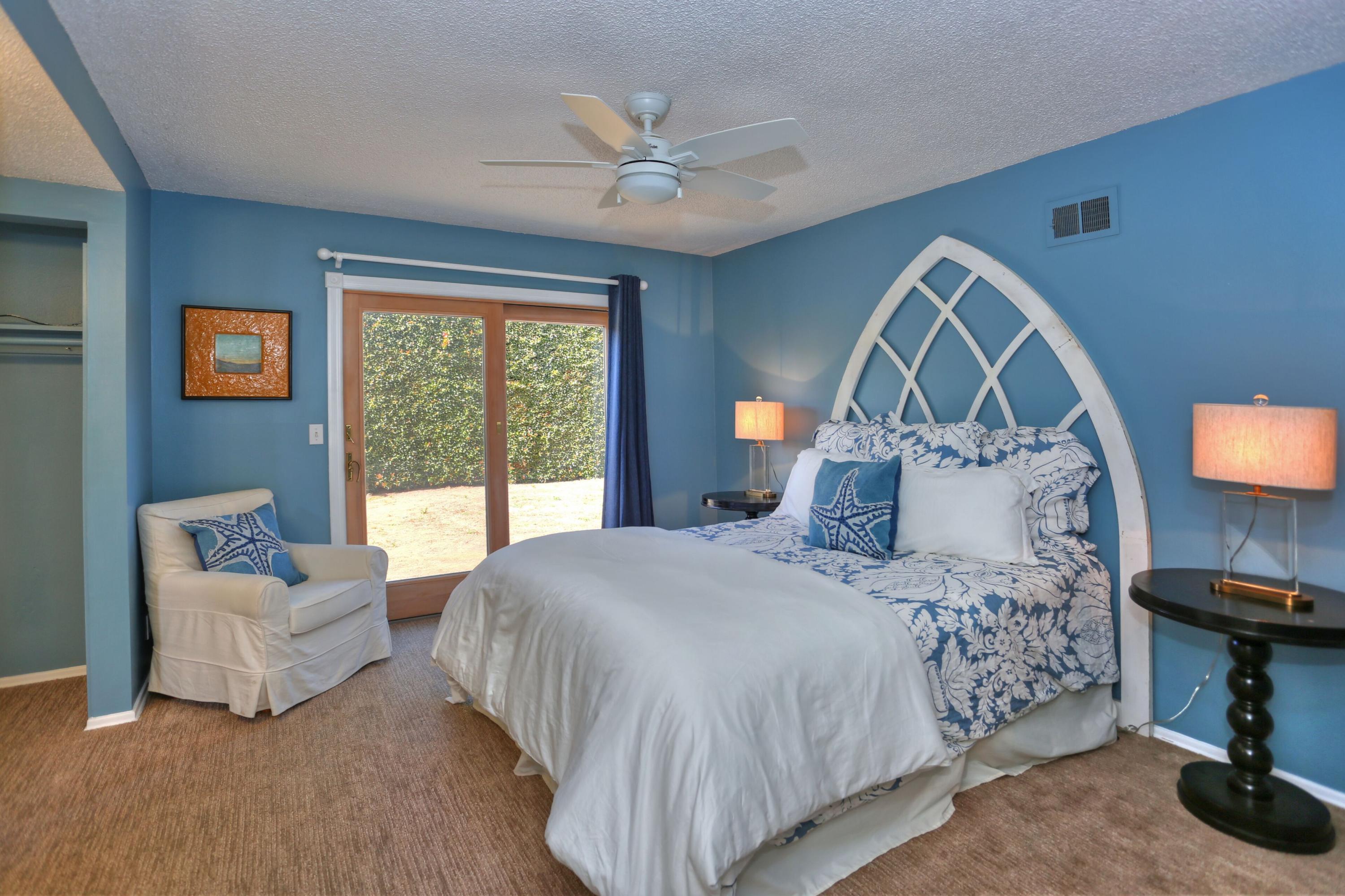 5668 Encina Road Goleta, CA 93117 - Photo 9 of 16 a bedroom with a large bed and a couch