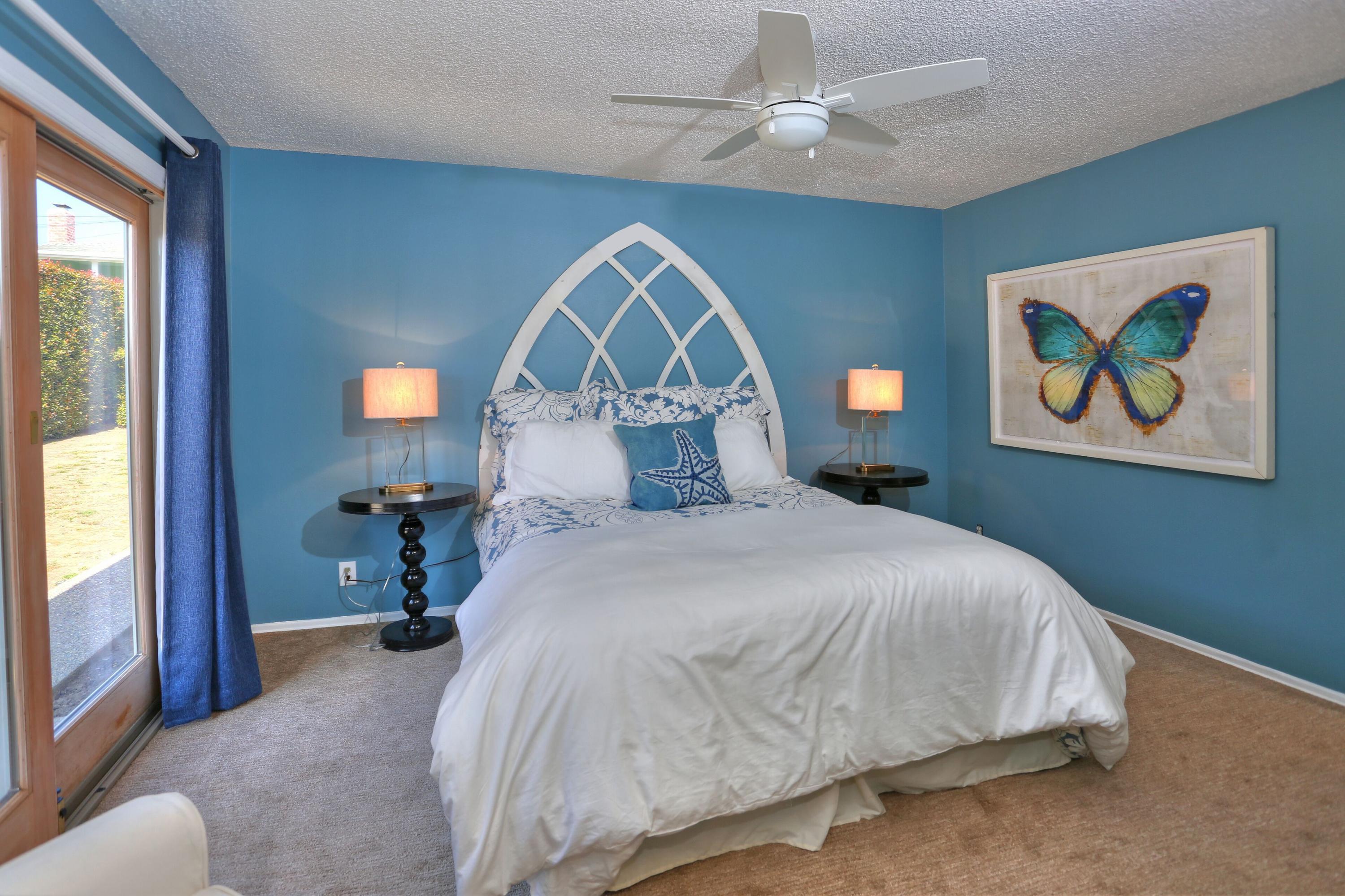 5668 Encina Road Goleta, CA 93117 - Photo 10 of 16 a bedroom with a bed and a painting on the wall