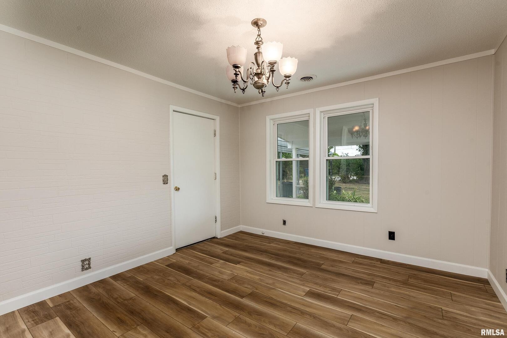 53 Private Road De Soto, IL 62924 - Photo 15 of 38 a view of an empty room with wooden floor and a window