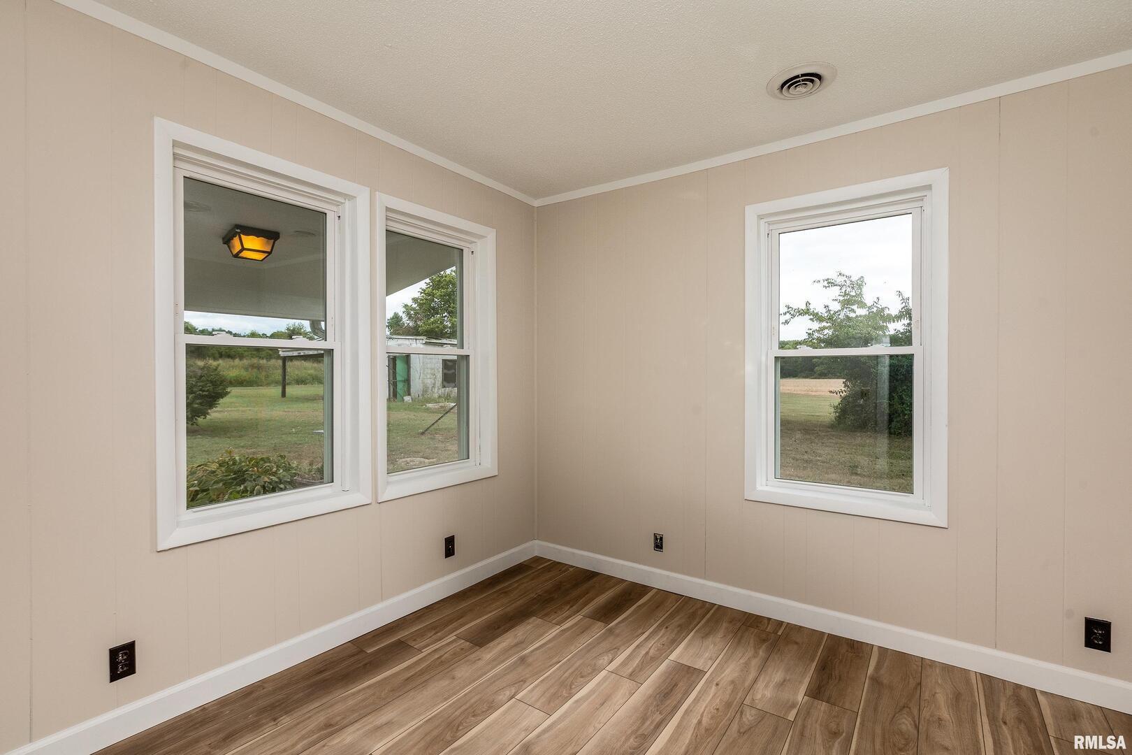 53 Private Road De Soto, IL 62924 - Photo 16 of 38 a view of an empty room with a window and wooden floor