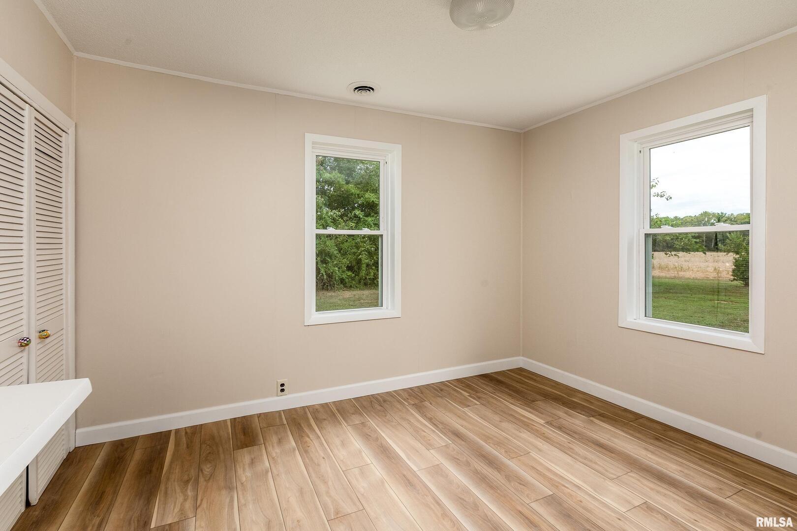 53 Private Road De Soto, IL 62924 - Photo 19 of 38 a view of a room with wooden floor and windows