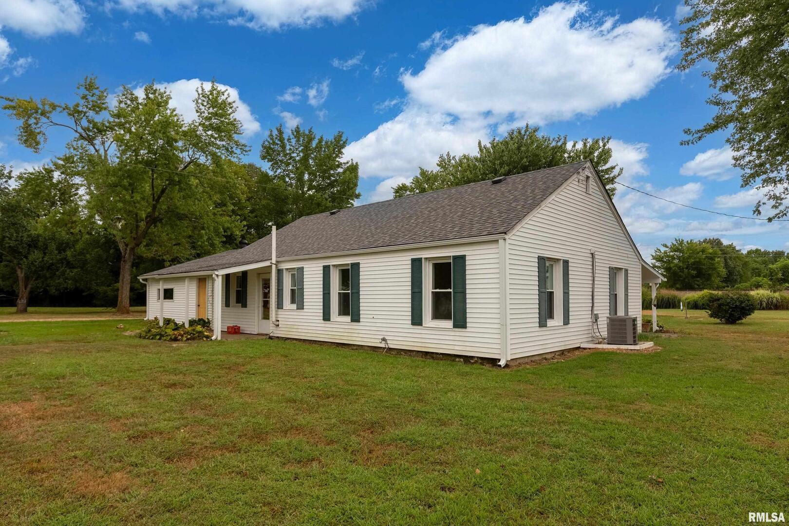 53 Private Road De Soto, IL 62924 - Photo 24 of 38 a front view of house with yard and trees in the background