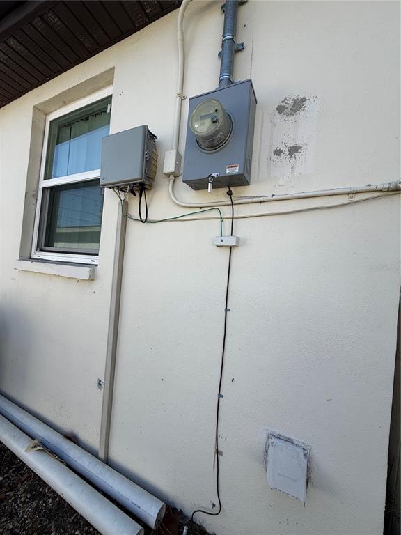 6100 Main Street, Unit A New Port Richey, FL 34653 - Photo 13 of 23 a room with a wooden floor and white wall