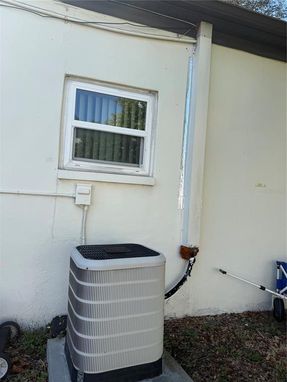 6100 Main Street, Unit A New Port Richey, FL 34653 - Photo 14 of 23 a room with a chair and potted plant