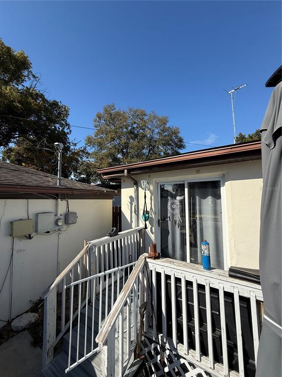 6100 Main Street, Unit A New Port Richey, FL 34653 - Photo 15 of 23 a view of balcony with furniture and trees