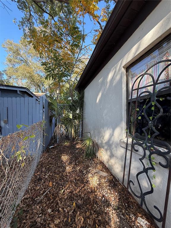 6100 Main Street, Unit A New Port Richey, FL 34653 - Photo 20 of 23 a view of backyard with wooden fence