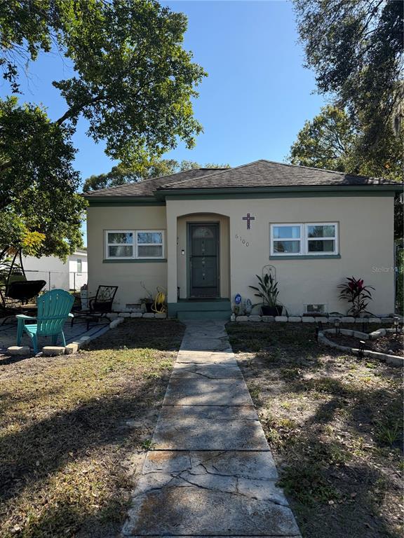 6100 Main Street, Unit A New Port Richey, FL 34653 - Photo 22 of 23 a front view of a house with garden
