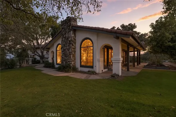 a front view of a house with garden
