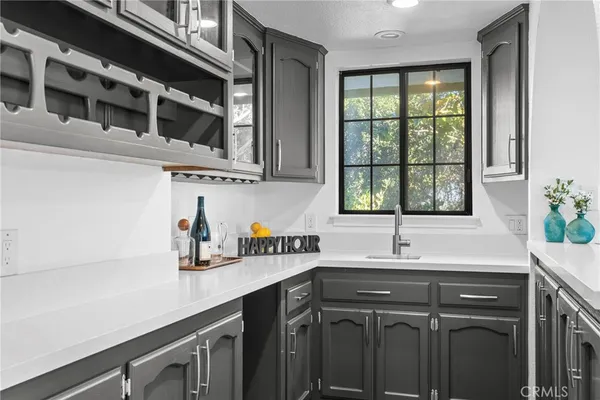 a kitchen with stainless steel appliances a sink and a window