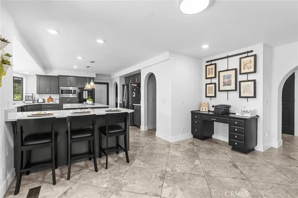 a view of a dining room with furniture and window