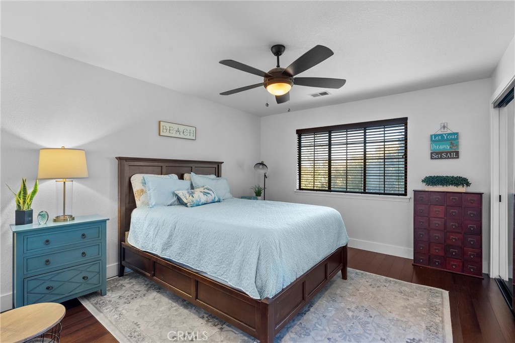 5750 Robin Court Santa Maria, CA 93455 - Photo 31 of 56 a bedroom with a bed and a dresser next to a window