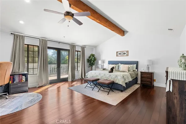 a spacious bathroom with a granite countertop sink mirror and shower