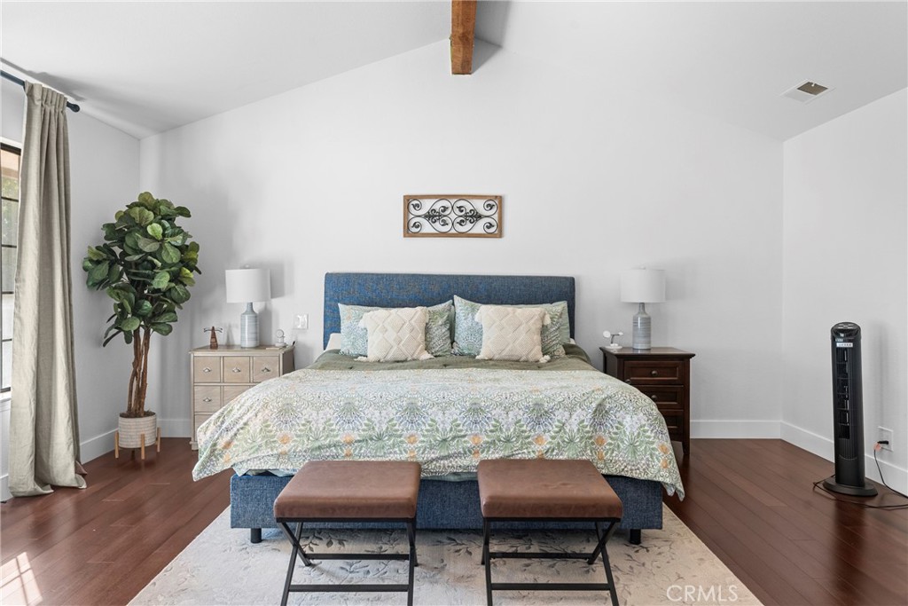 5750 Robin Court Santa Maria, CA 93455 - Photo 36 of 56 a bedroom with a bed table and a potted plant