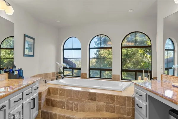 a kitchen with a stove top oven and refrigerator