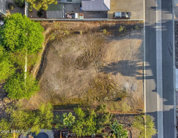 front view of a brick house with a yard